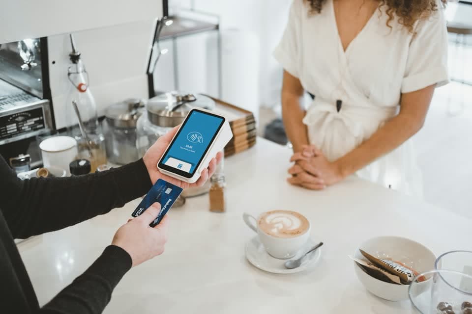 A card terminal on a café counter